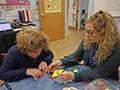  Teacher works with visually impaired student